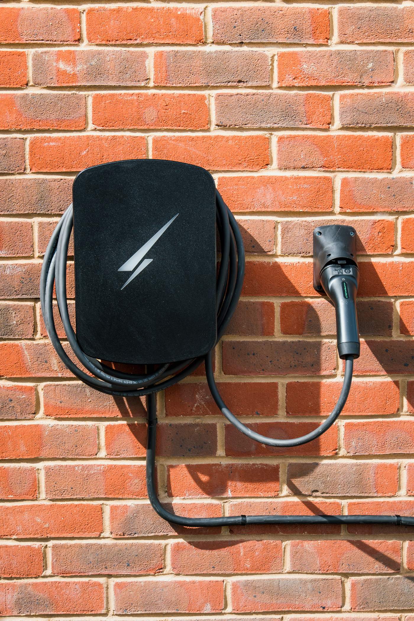 Hypervolt EV charger installed on a brick wall by Nexus Electrical