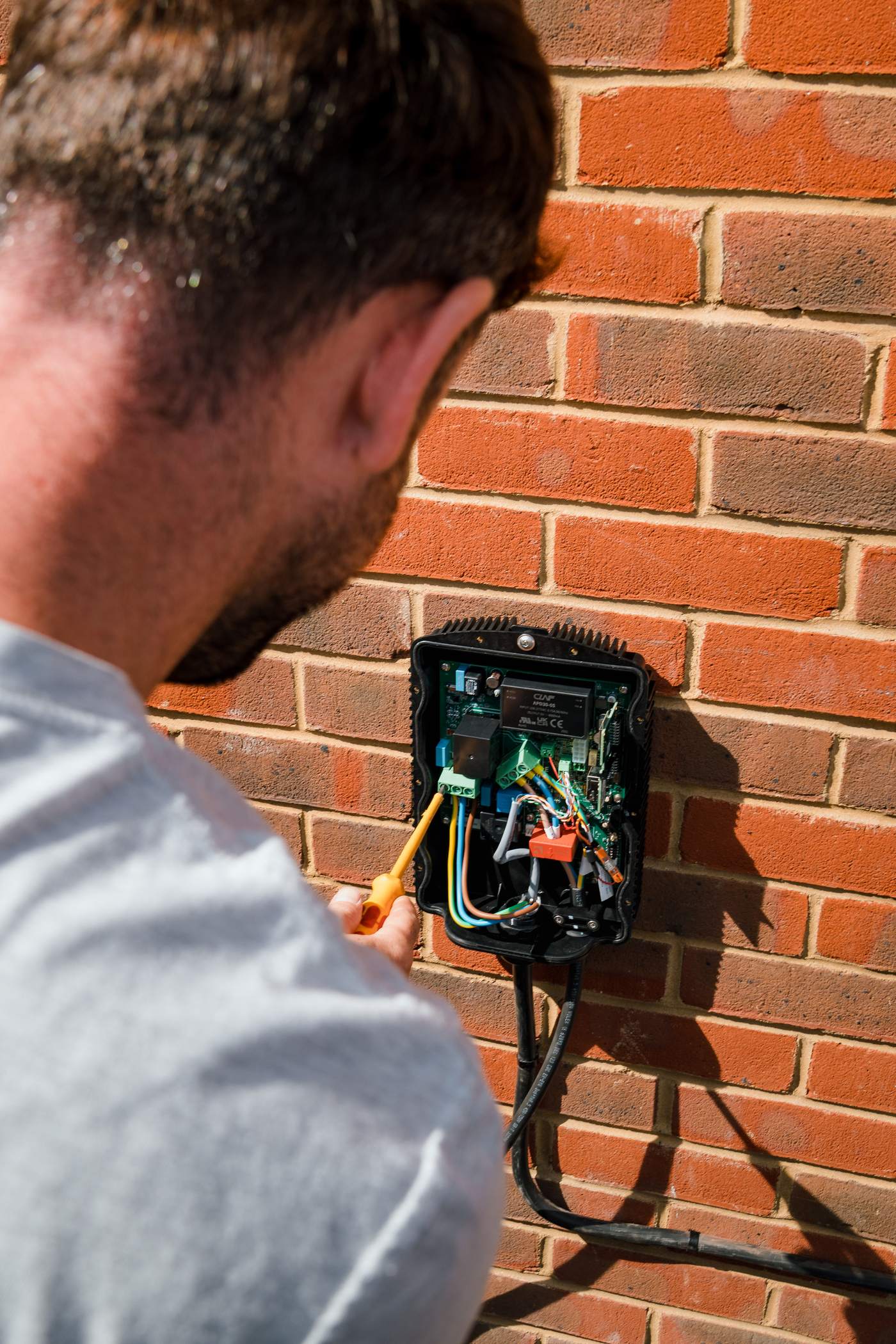 Tom connecting the wiring inside a Hypervolt charger