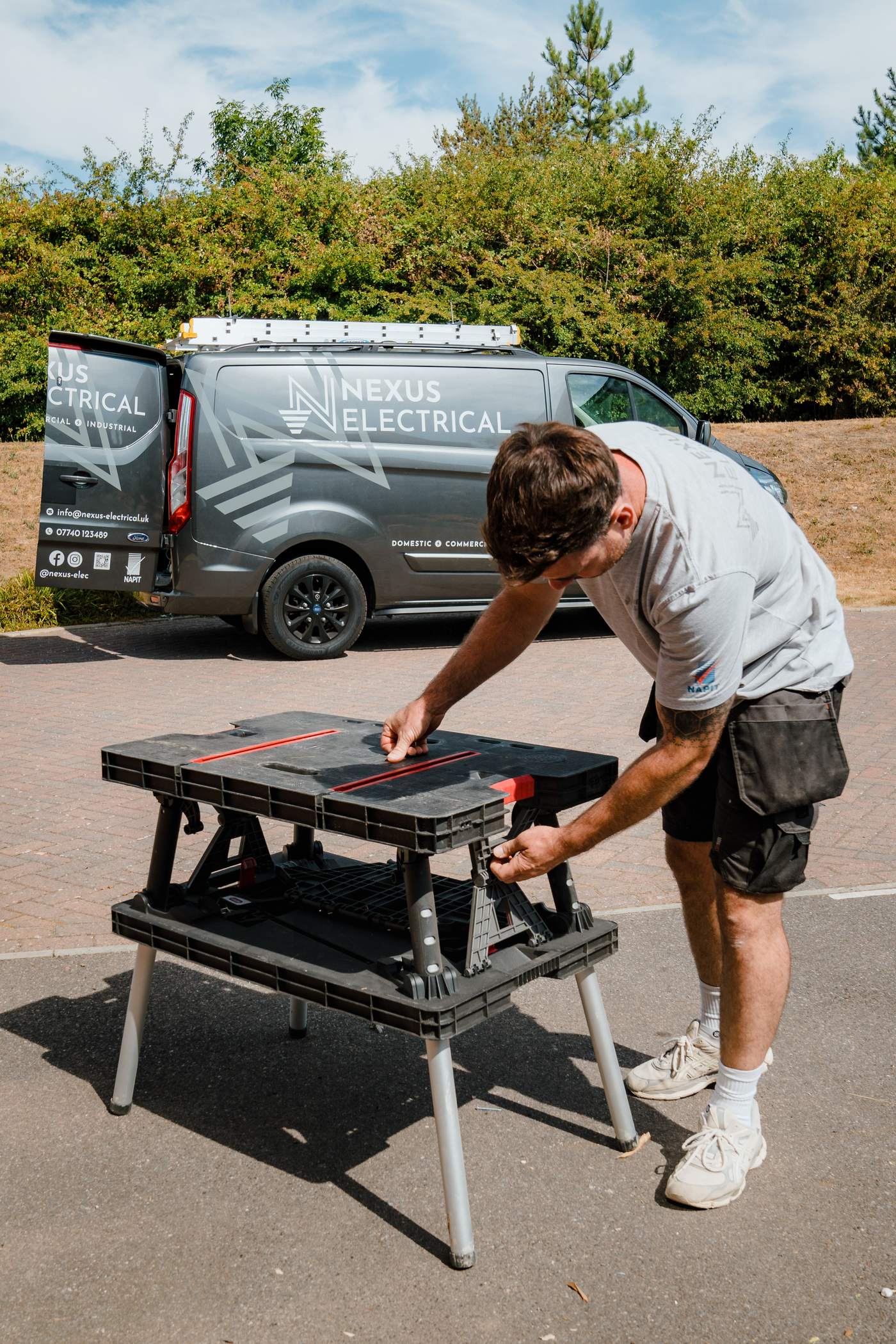 Tom from Nexus Electrical setting up next to the Nexus van