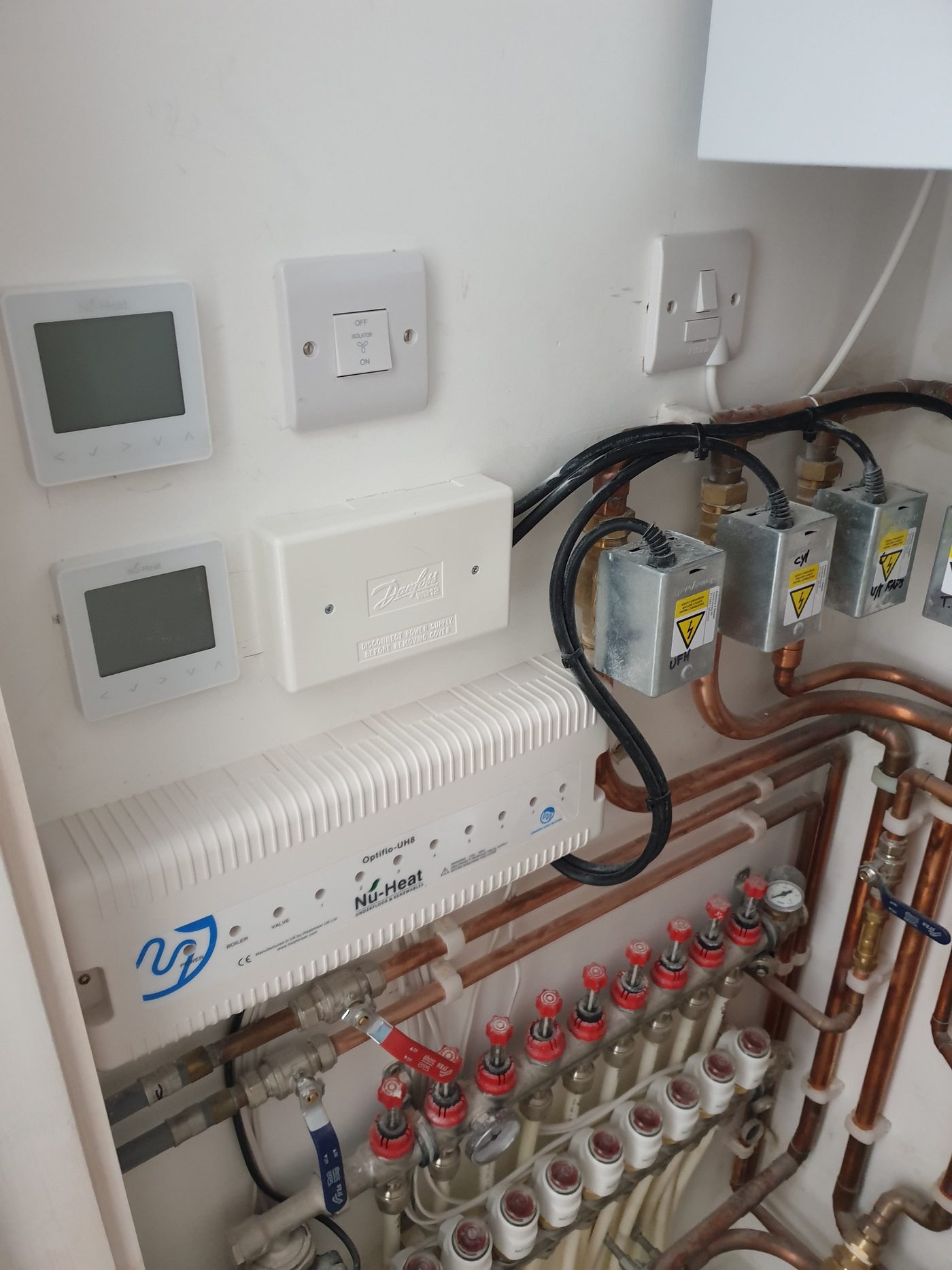 Underfloor heating wiring centre, thermostats and manifold wired by Nexus Electrical